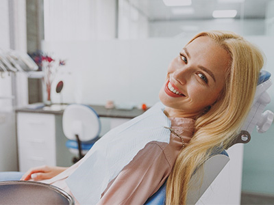 Blonde woman leaning back in dental chair