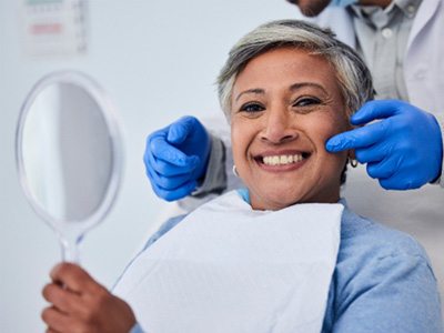 A senior woman receiving a dental checkup 