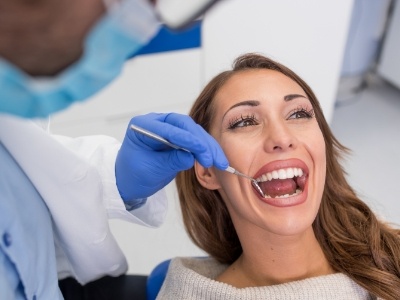 Woman opening her mouth for preventive dentistry checkup in Encinitas