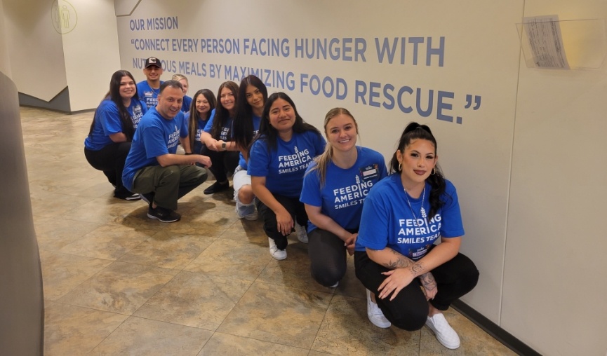 Encinitas dental team wearing matching blue tee shirts for Feeding America