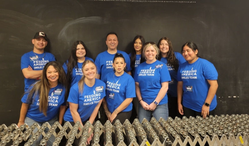 Entire dental team smiling after volunteering after Feeding San Diego