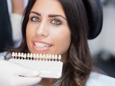 Woman getting veneers from her cosmetic dentist in Encinitas