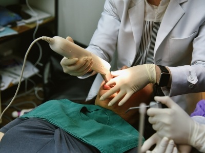 Dentist capturing digital dental impressions of a patients teeth