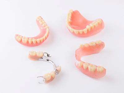 Sets of dentures against a white background