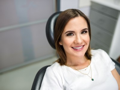 Young woman smiling in dental chair