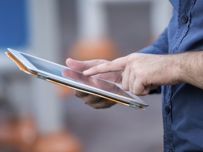 Person touching a tablet screen