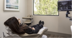 Young woman sitting in dental chair